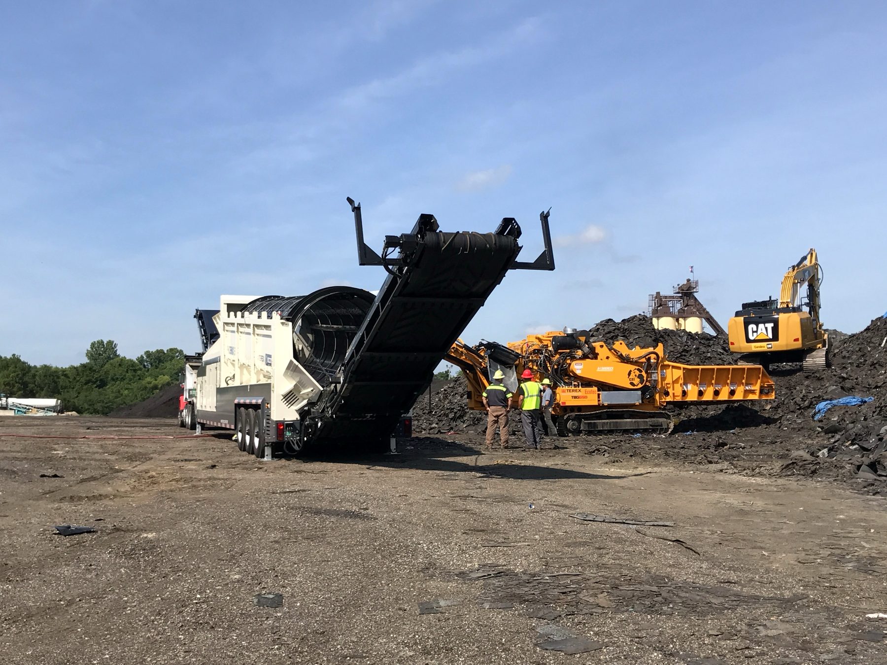 A-1 shingle grinder and trommel screen set up at an asphalt plant