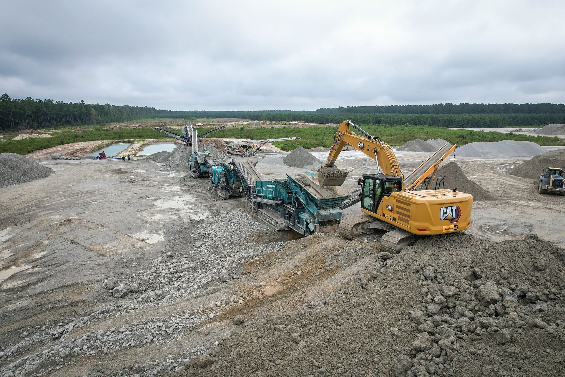 A-1 excavator feeding a mobile crushing and screening spread