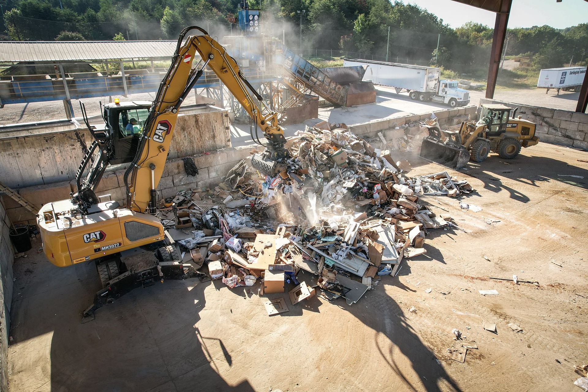 Excavator sorting material on the Abbey Green tipping floor