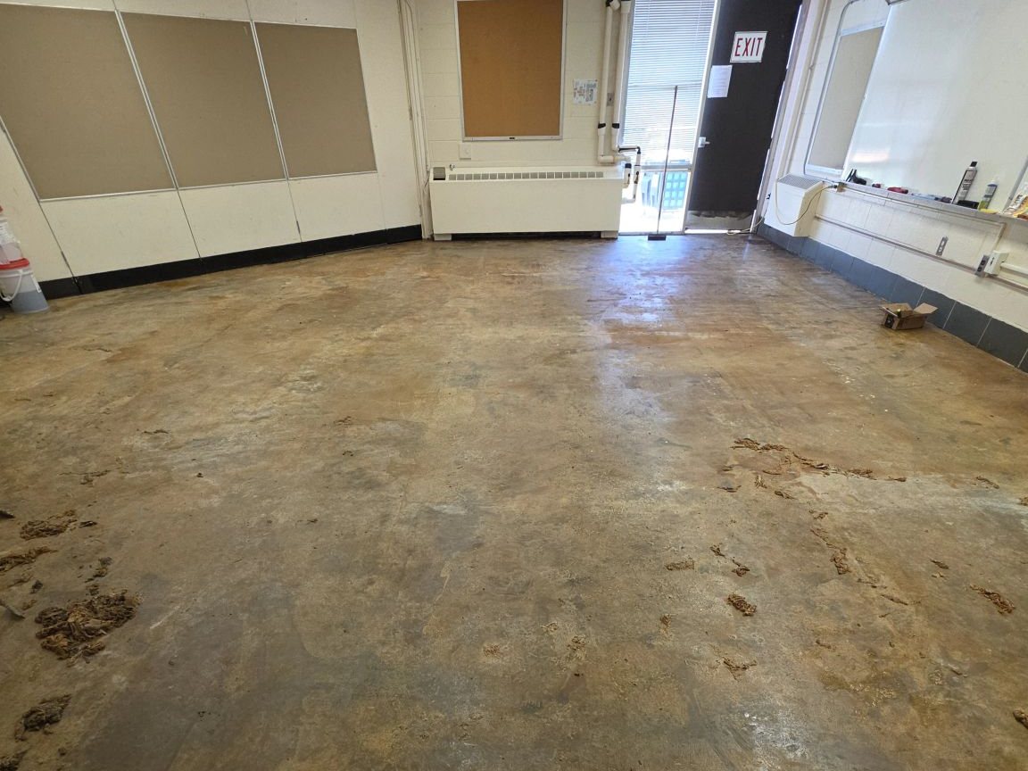 Classroom floor after asbestos floor tile removal, ready for new flooring