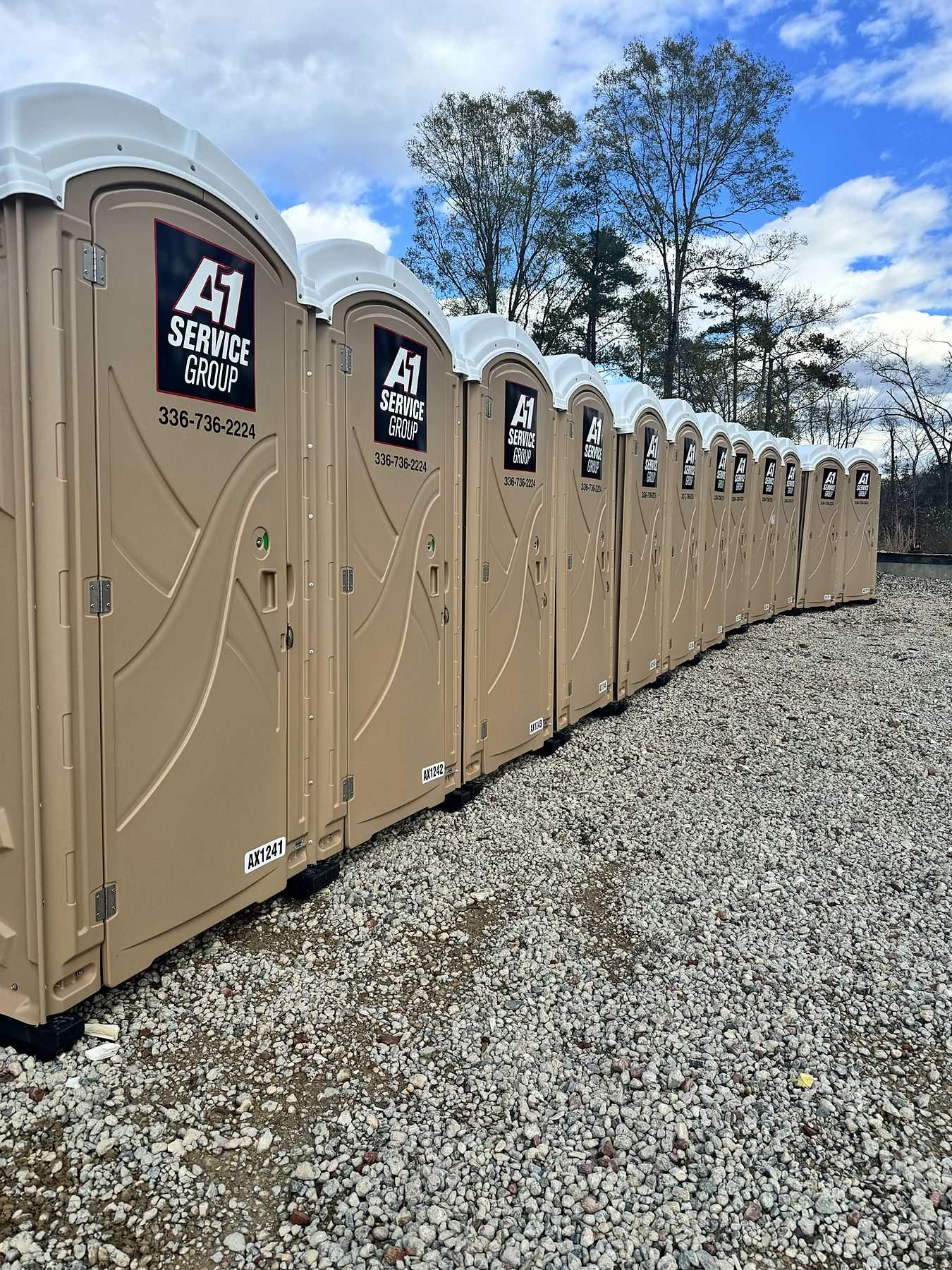 Row of clean A-1 portable toilets ready to go