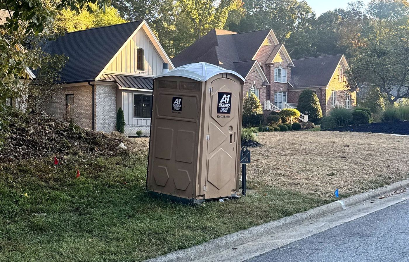 A-1 Service Group portable toilet on a custom home lot in Grandover, Greensboro, NC