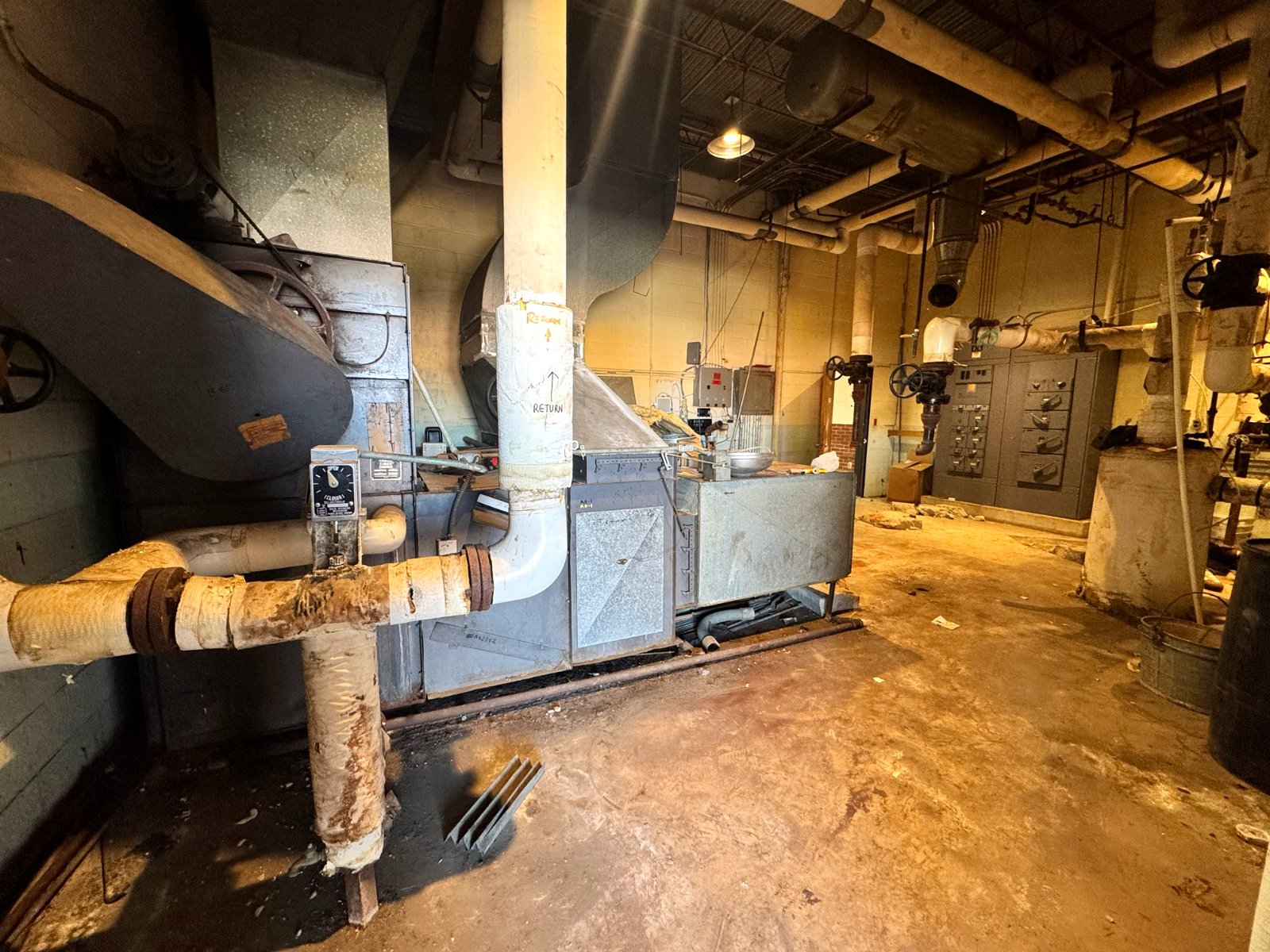 Mechanical room with old pipe insulation inside the former Lexington post office